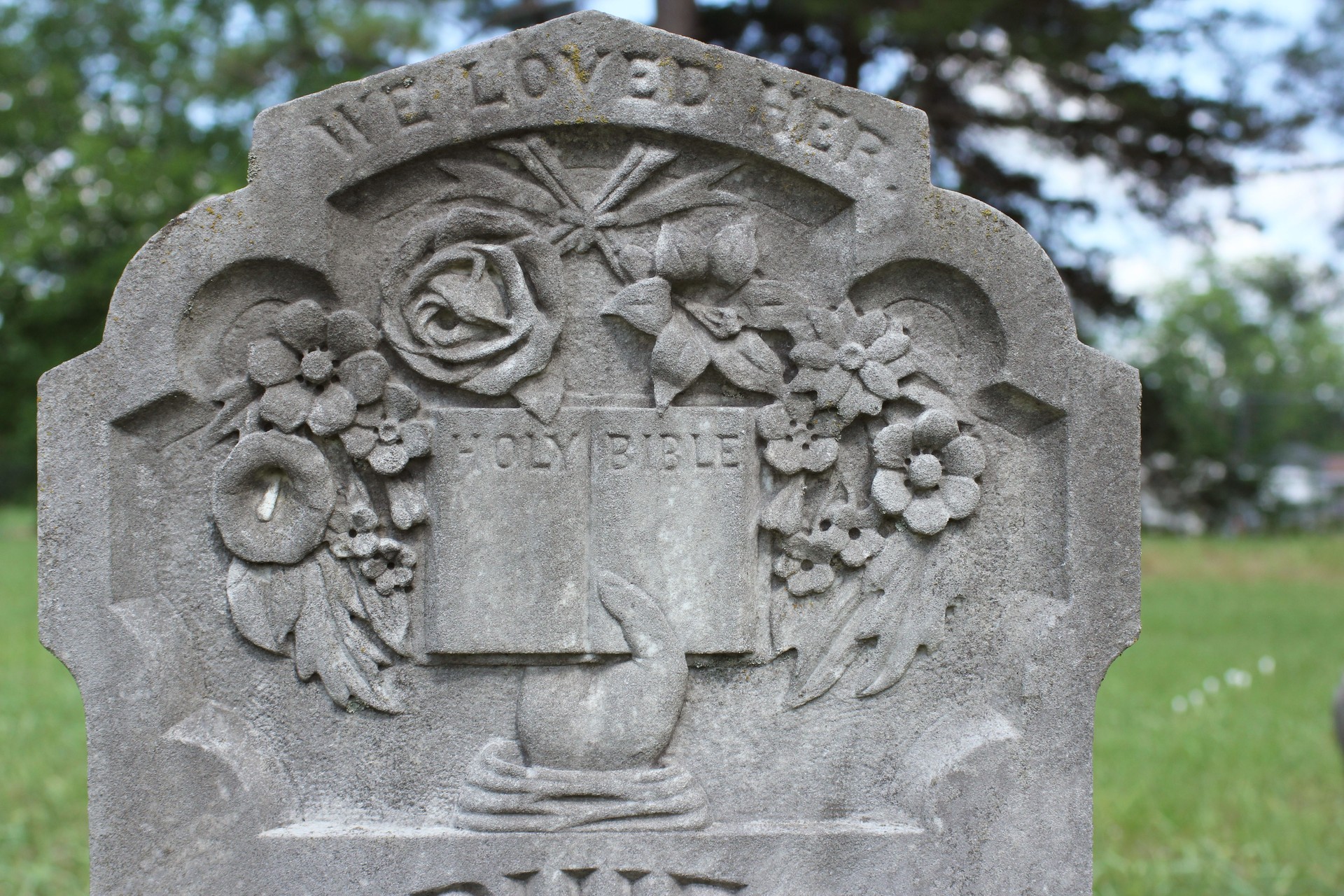 Close up of Historic Headstone With Floral Design in Rural East TX Cemetery